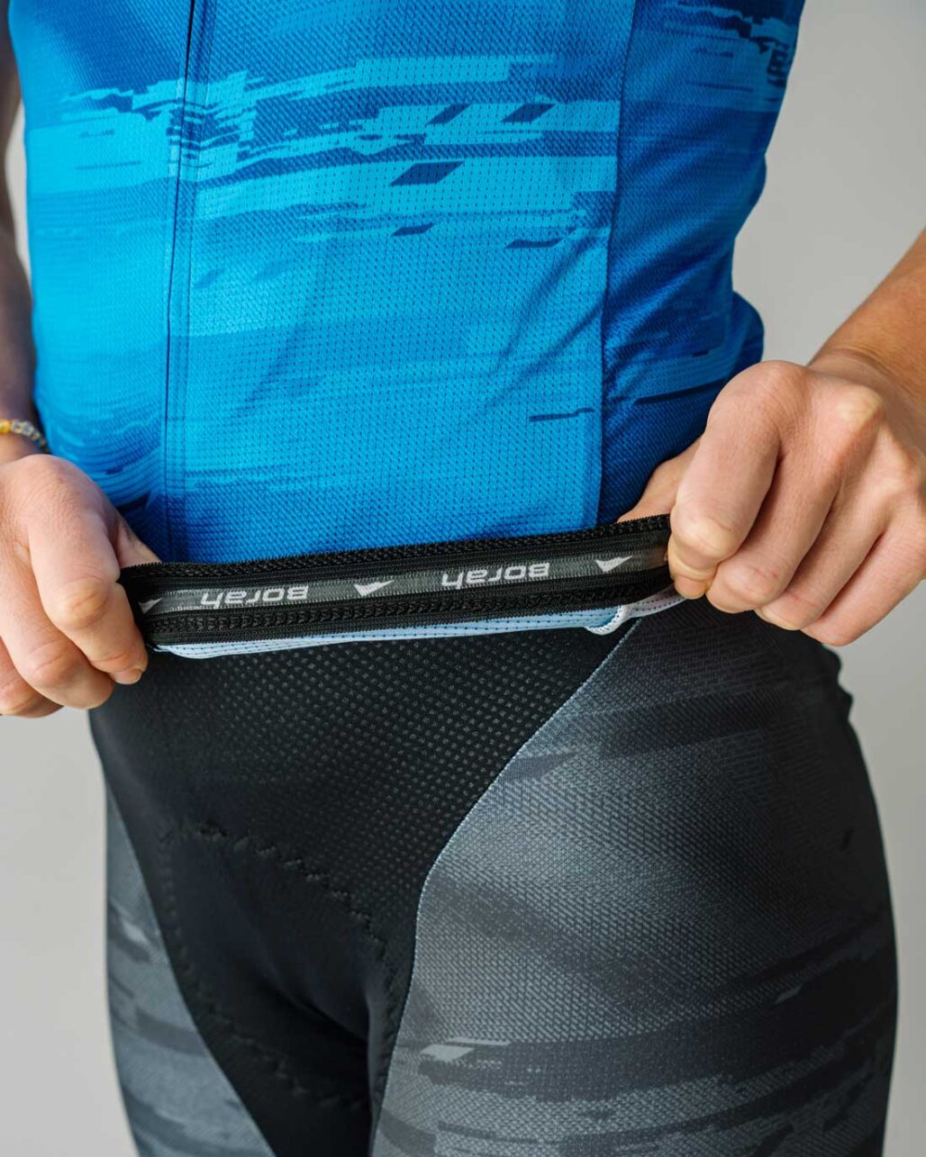 Silicone gripper detail shot of the custom Women's OTW Spark Cycling Jersey.