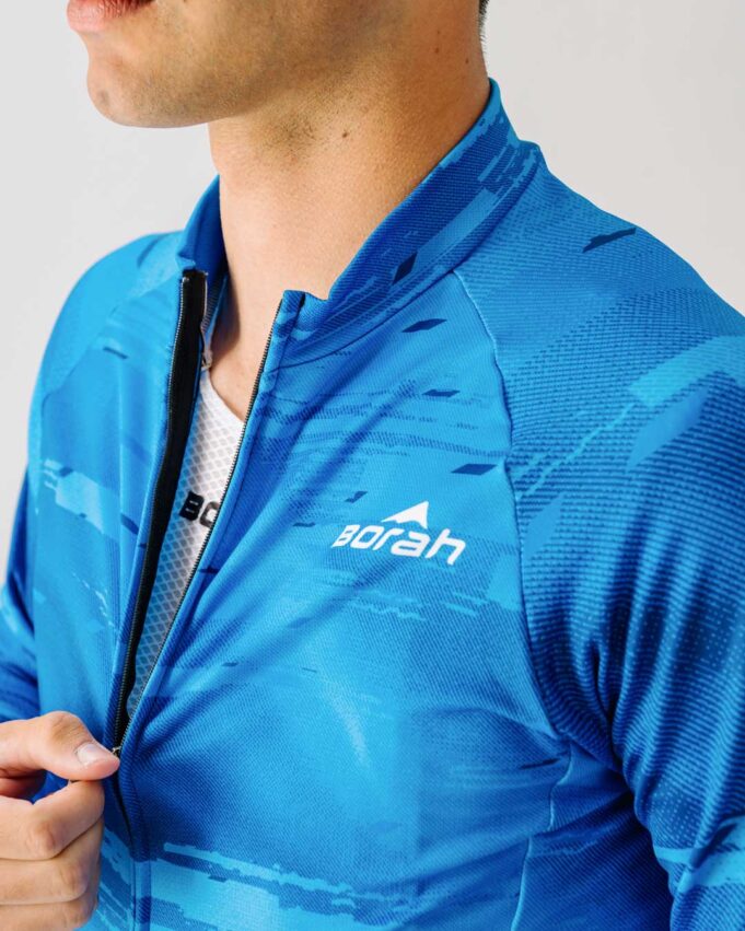 Athlete unzipping the Team Long Sleeve Cycling Jersey.