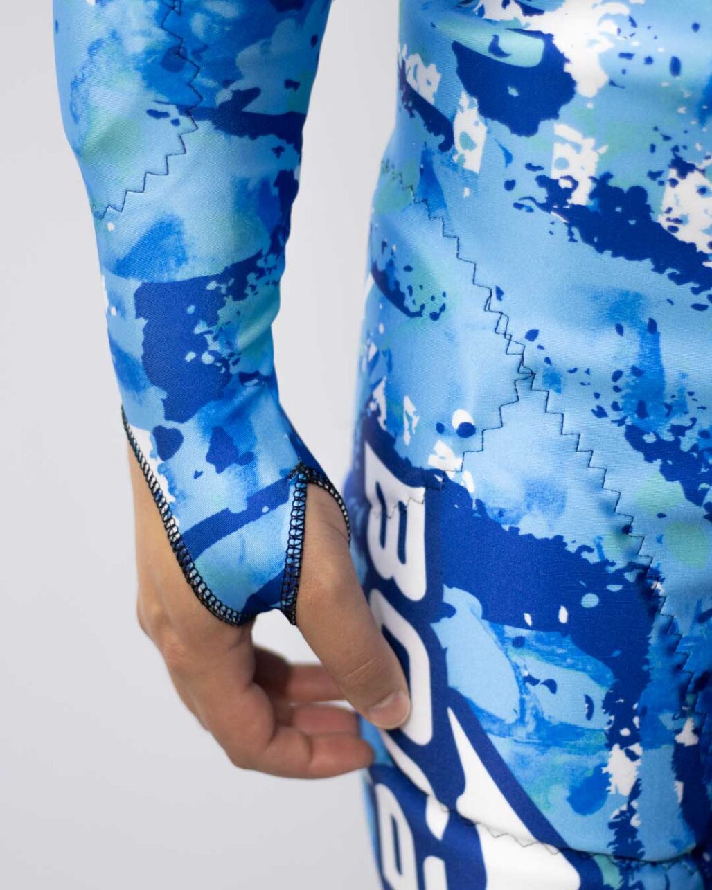 Adult Alpine Race Suit thumb strap detail shot.