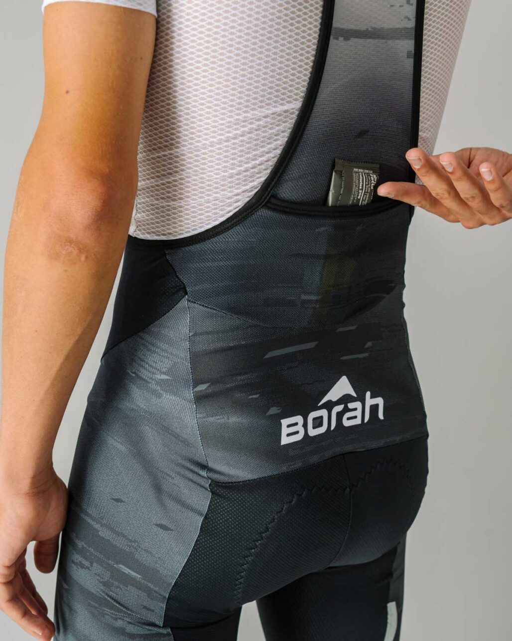 Men's OTW Spark Cycling Bib rear pocket detail view.