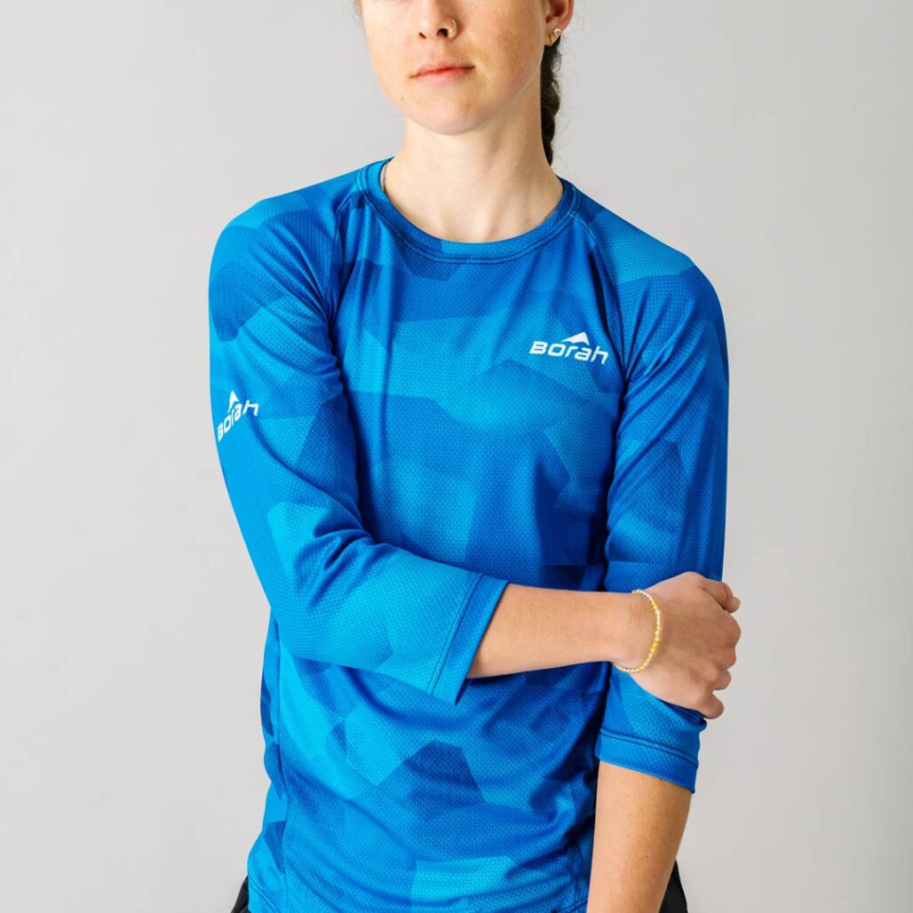 Front facing photo of a female wearing the new Women's Pro 3/4 Sleeve Freeride MTB Jersey.