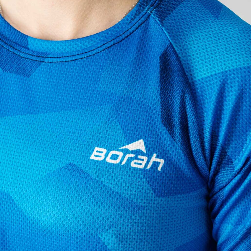 Photo of a female wearing the new Women's Pro 3/4 Sleeve Freeride MTB Jersey focusing on the fabric detail.