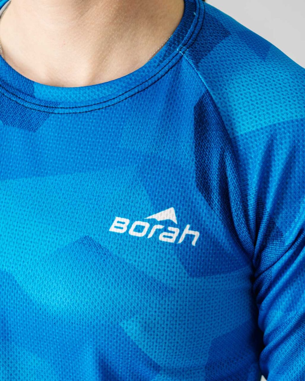 Photo of a female wearing the new Women's Pro 3/4 Sleeve Freeride MTB Jersey focusing on the fabric detail.