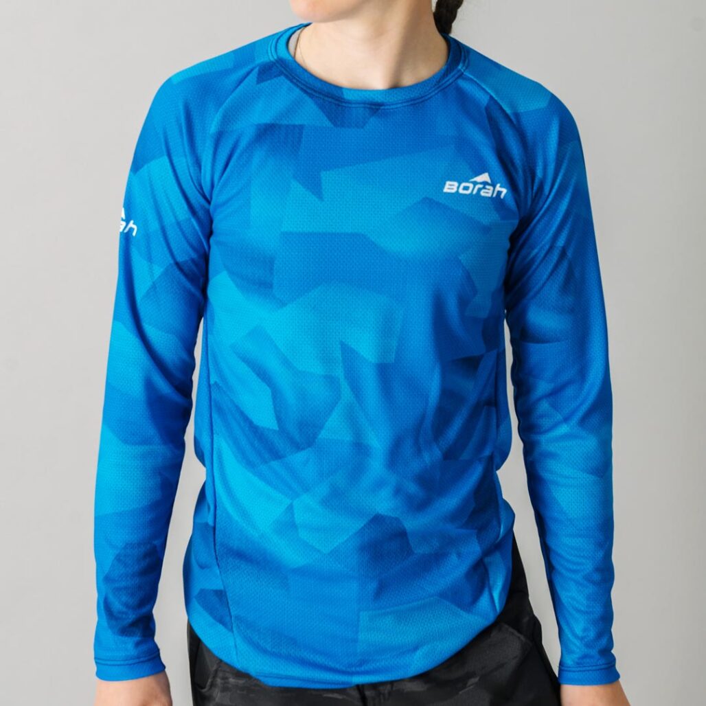 Front facing photo of a female wearing the new Women's Pro Long Sleeve Freeride MTB Jersey.