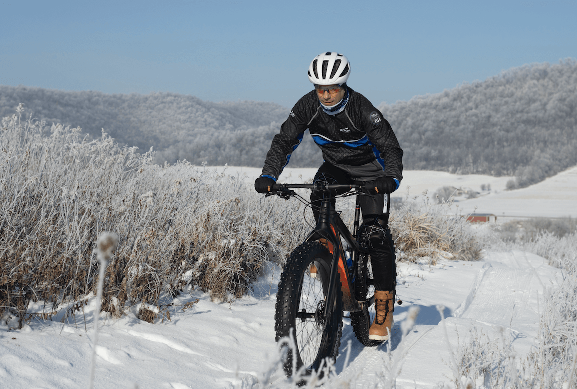 Borah Teamwear's owner, Chris Jackson, riding his fat bike on a winter day in Coon Valley, WI.