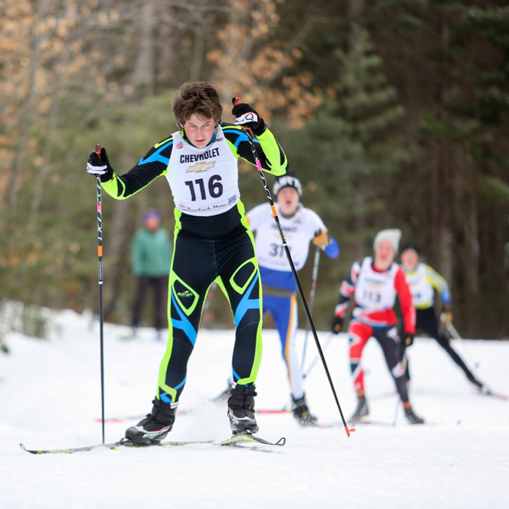 Youth Nordic skier racing.