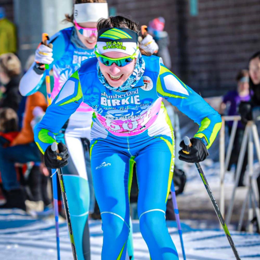 Female Nordic skier smiling at the Birkie.