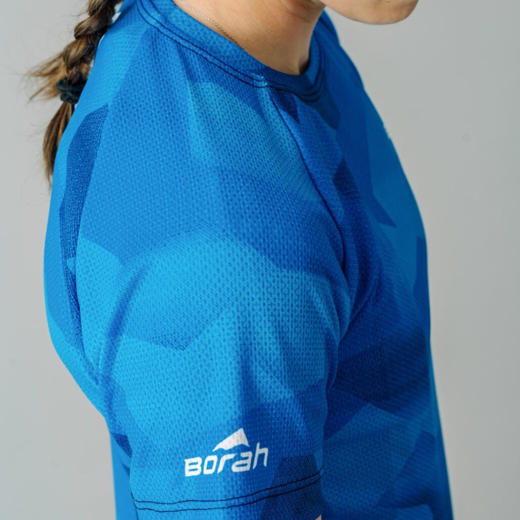 Photo of a female wearing the new Women's Pro Freeride MTB Jersey focusing on the fabric detail.