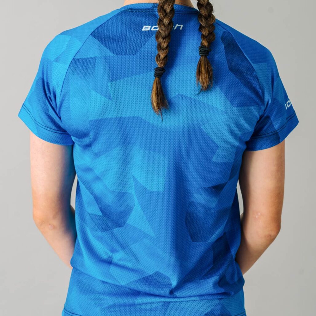 Back facing photo of a female wearing the new Women's Pro Freeride MTB Jersey.